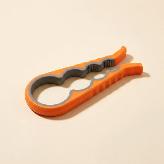 Orange easy-grip 4-in-1 jar opener on a cream studio background, showing the non-slip rubber lining for four lid sizes